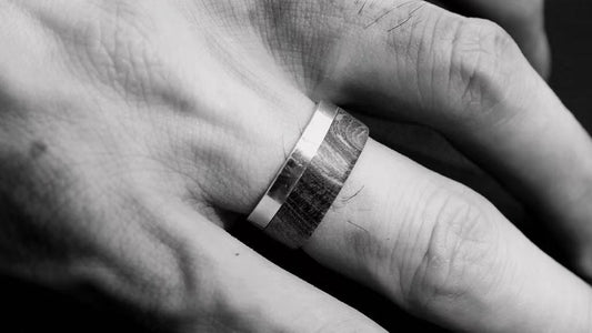 Men's textured wedding band worn on the hand